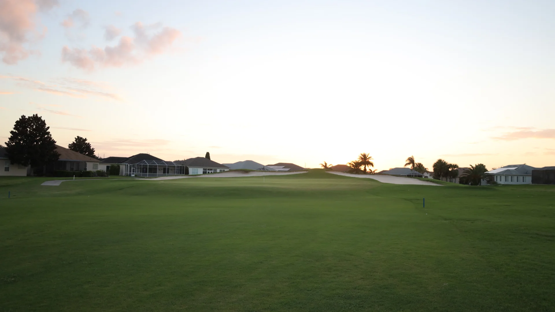 Image of golf ball on tee on grass.